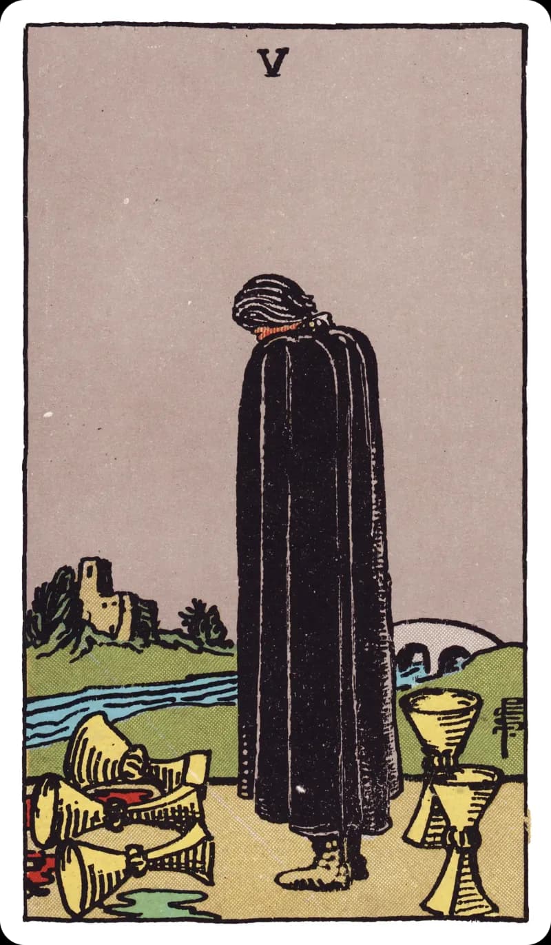 Five of Cups tarot card — black-cloaked figure gazing at three spilled cups while two stand upright behind, bridge and castle in the distance, Rider-Waite-Smith deck