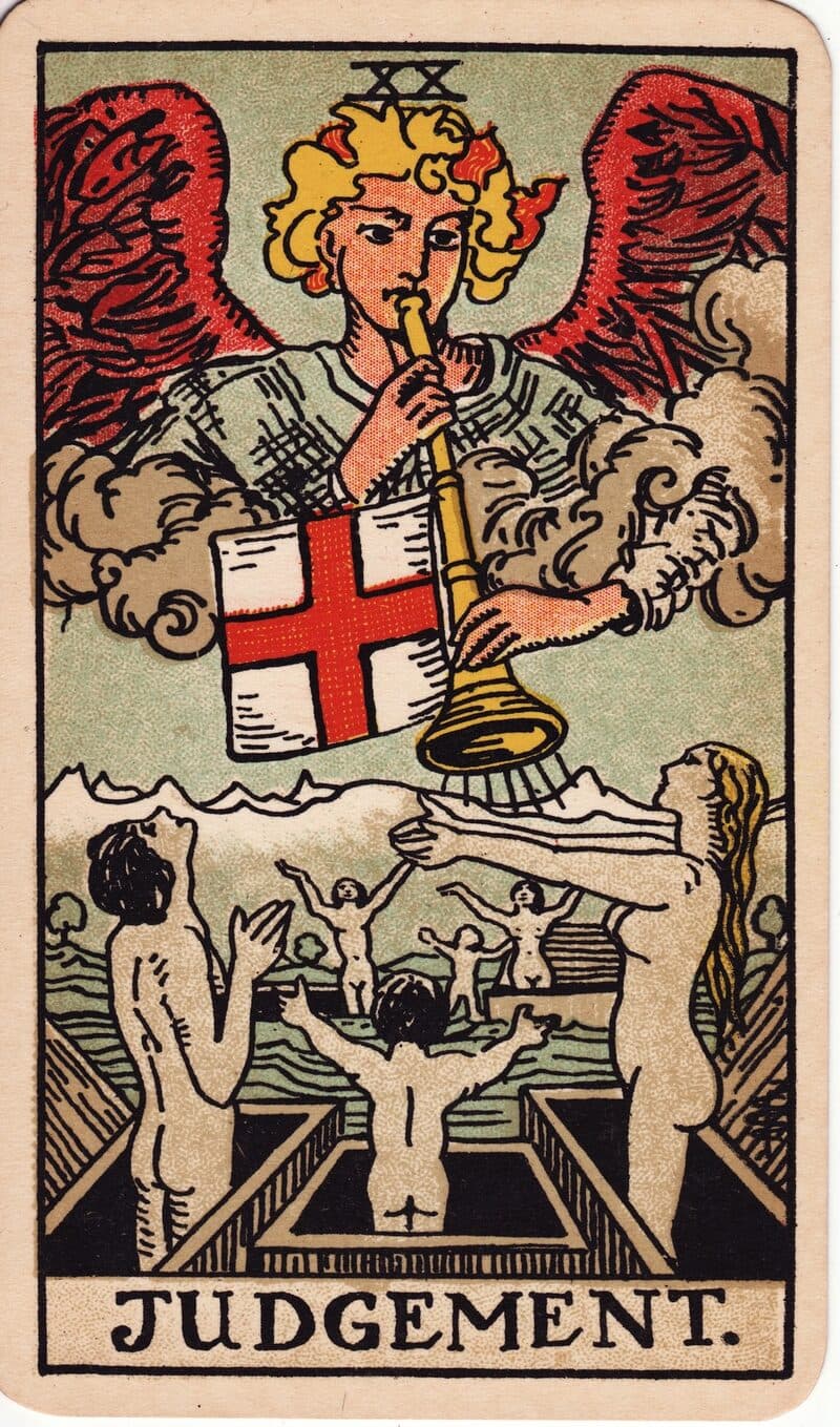 Judgement tarot card — angel sounding a trumpet above figures rising from open coffins, Rider-Waite-Smith deck