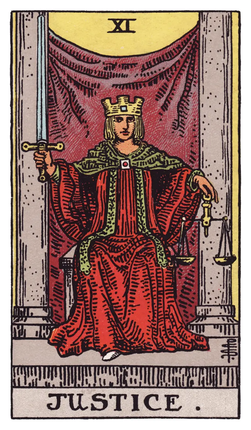 Justice tarot card — crowned figure holding a raised sword and balanced scales between two pillars, Rider-Waite-Smith deck
