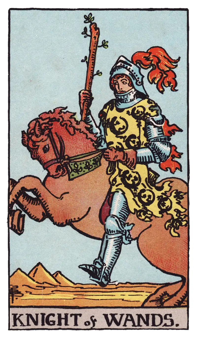 Knight of Wands tarot card — armored knight raising a wand on a rearing horse before desert sands and distant pyramids, Rider-Waite-Smith deck