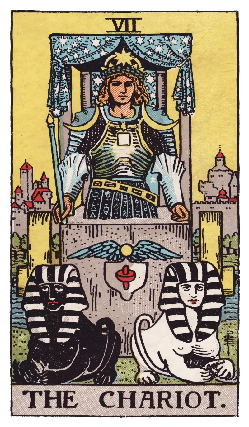 The Chariot tarot card — armored figure in stone chariot driven by black and white sphinxes, Rider-Waite-Smith deck