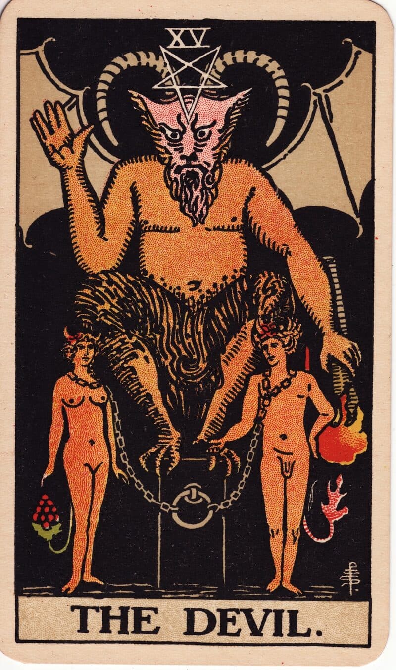 The Devil tarot card — horned figure on a black cube with two loosely chained nude figures below, Rider-Waite-Smith deck