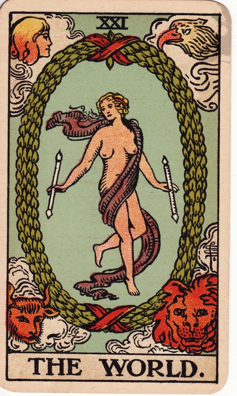 The World tarot card — dancing figure within a laurel wreath surrounded by four winged creatures, Rider-Waite-Smith deck