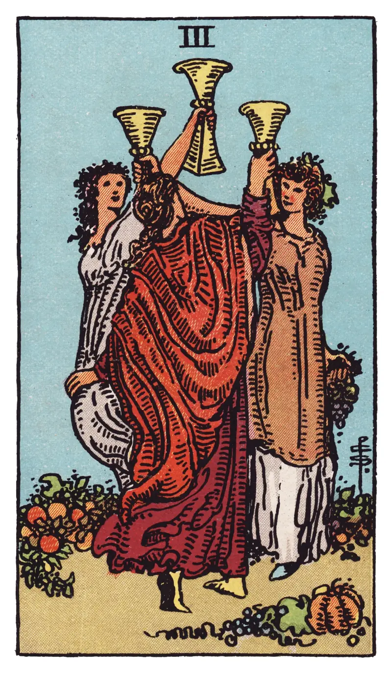 Three of Cups tarot card — three women raising their cups together in celebration amid abundant fruit and flowers, Rider-Waite-Smith deck